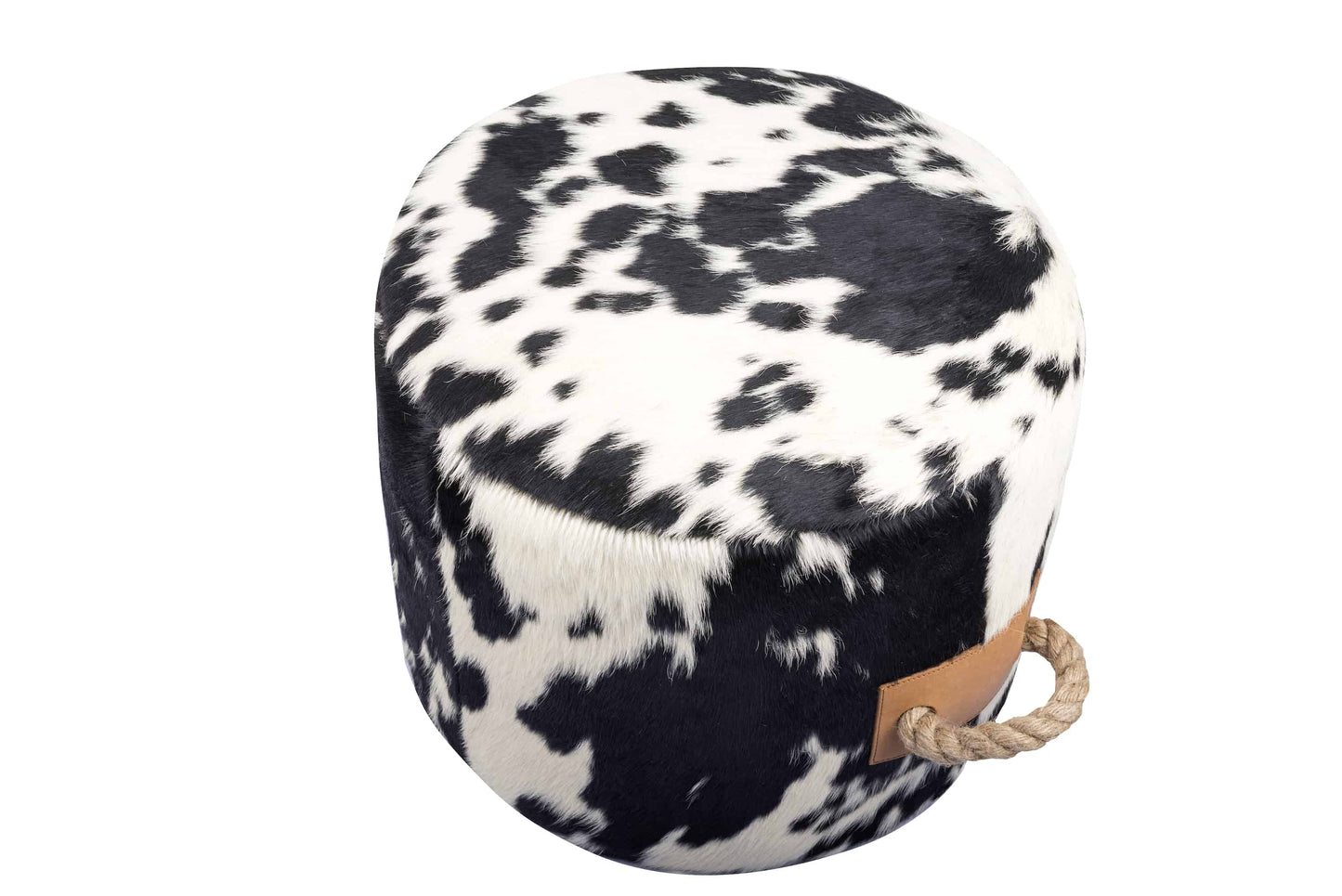 round cowhide ottoman with a natural black and white spotted pattern and tan leather tabs on the sides with thick, jute handles