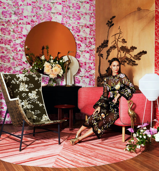 woman siting inside a beautifully decorated room with cowhide rug