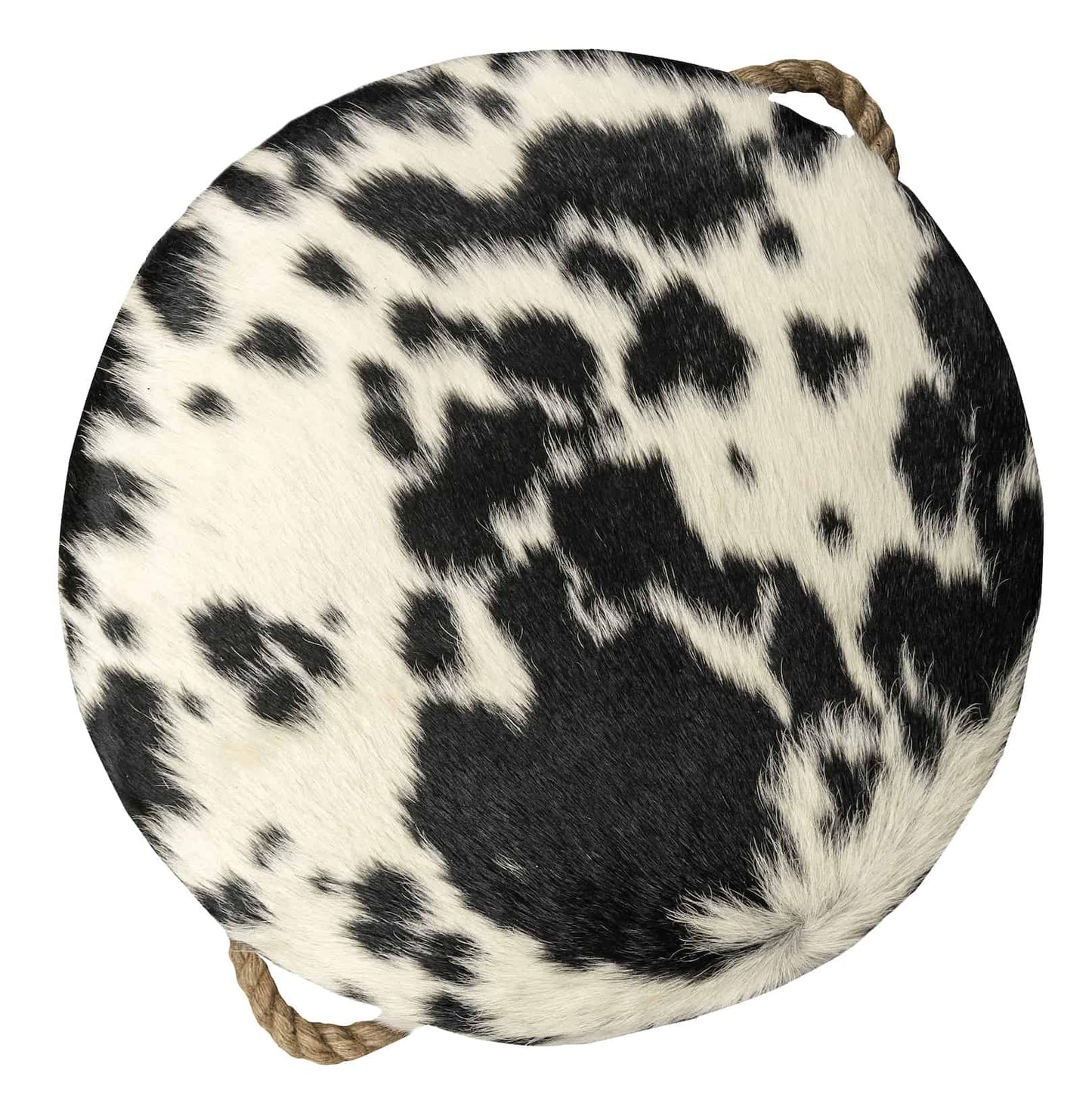 round cowhide ottoman with a natural black and white spotted pattern and tan leather tabs on the sides with thick, jute handles