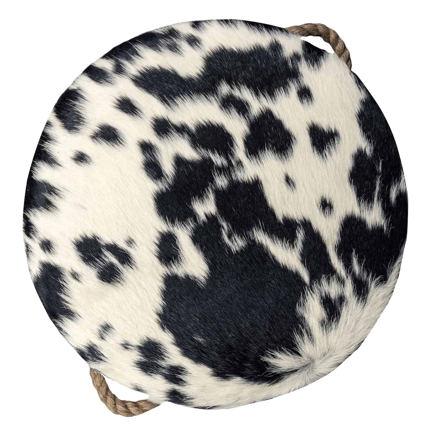 round cowhide ottoman with a natural black and white spotted pattern and tan leather tabs on the sides with thick, jute handles